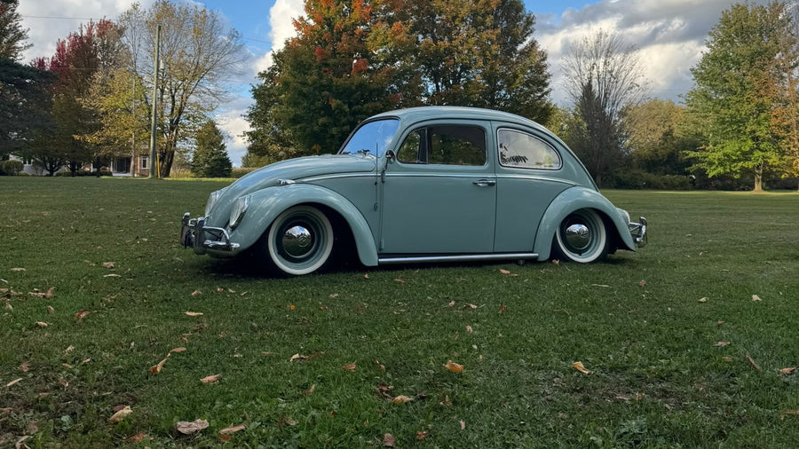 Mint-green classic Volkswagen Beetle aired out on grass - Lukaszsports x ONAIR build