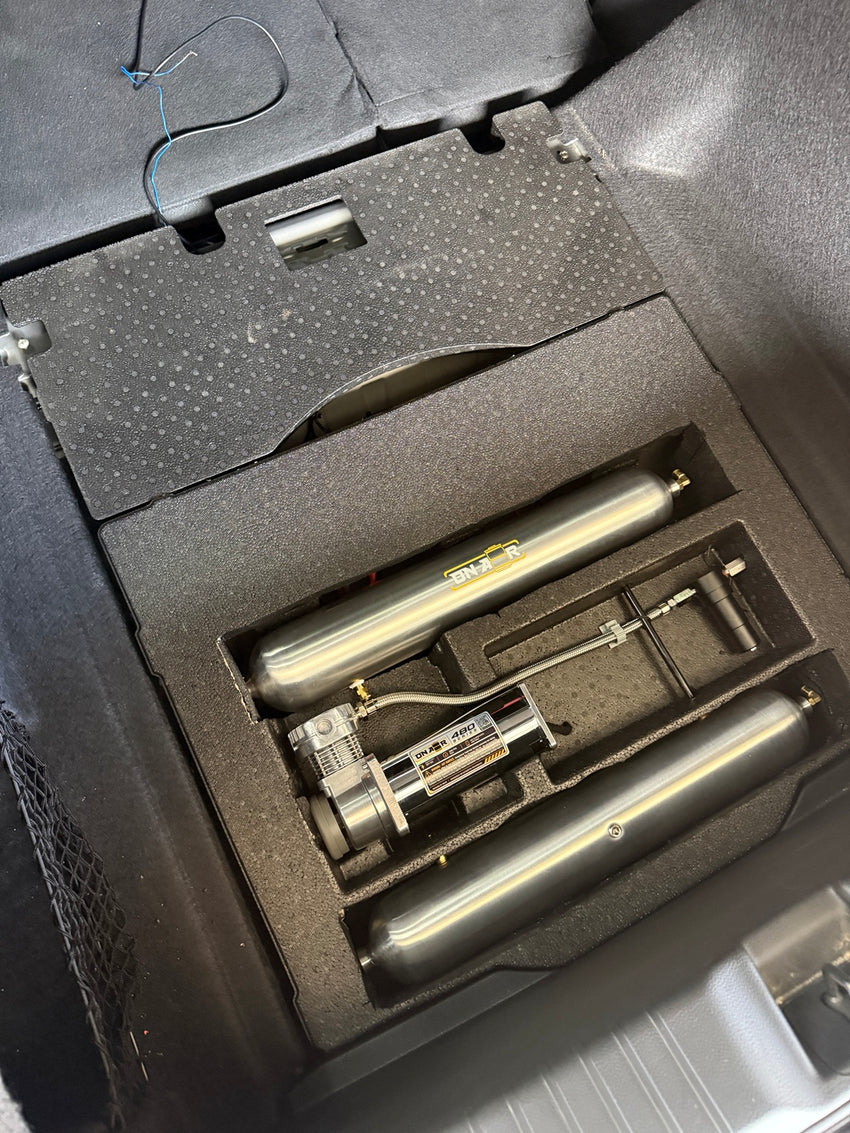 Acura Integra Type S hidden under-floor air ride installation with two seamless tanks and one compressor.