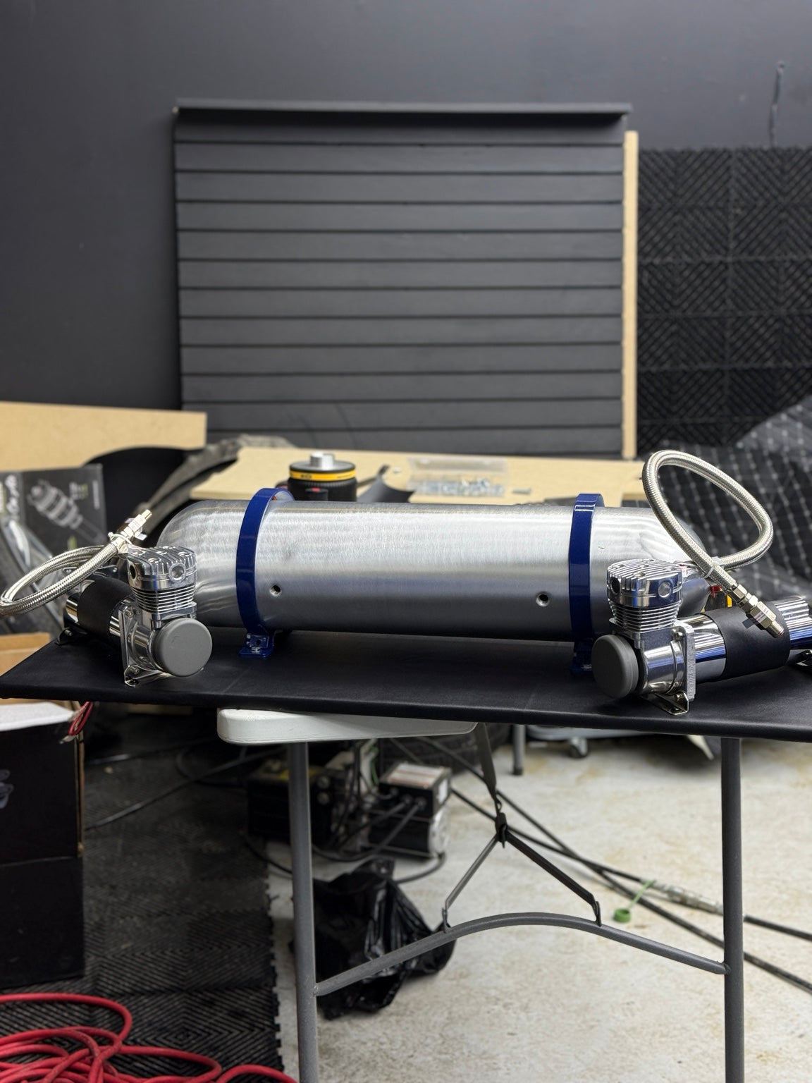 An existing ONAIR air management installation with a silver tank and dual chrome compressors