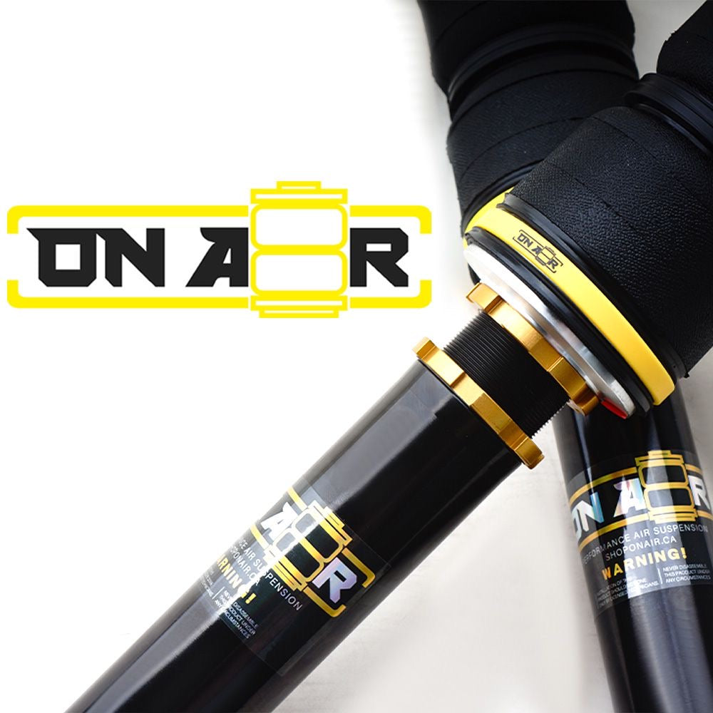 Collection of air suspension air bags onair made wrapped with a yellow band and gold collar rings. Rubber is textured with reinforced material. Brand logo and sticker on the shock/strut in a gallery layout