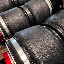 Collection of zoomed in shot of the rubber textured material on a set of onair struts air suspension in a gallery layout