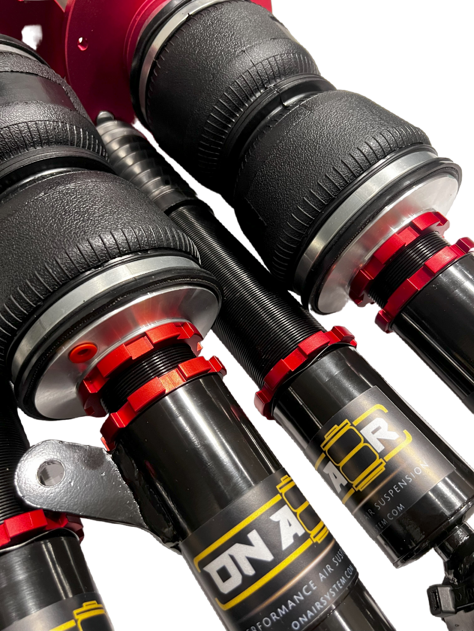 Collection of onair performance air suspension set of struts with red collar rings and branded stickers. Air bags have the reinforced rubber in a gallery layout