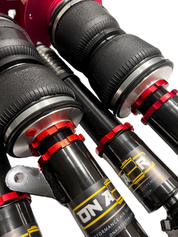 Collection of onair performance air suspension set of struts with red collar rings and branded stickers. Air bags have the reinforced rubber in a gallery layout